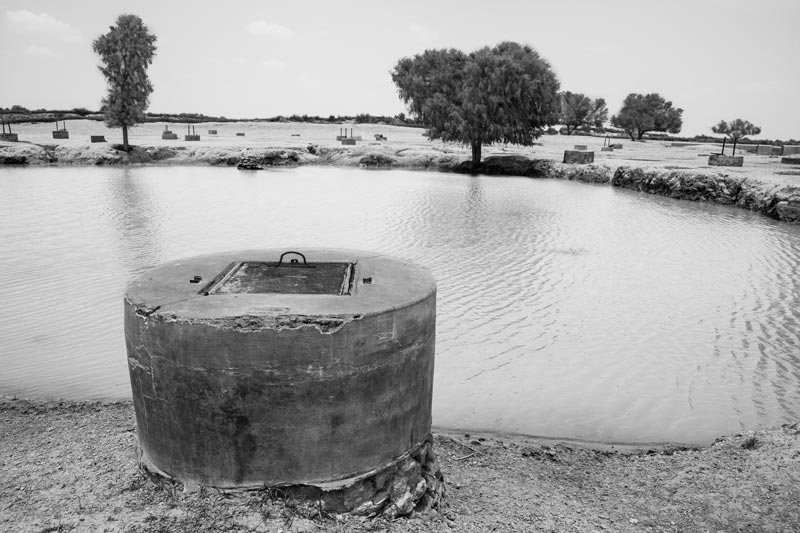 Integrated Solution for Rural Drinking Water Challenges - shallow well (locally called 'kuiyan') being recharged by an adjacent pond that attains water through drainage from the local village catchment in Bikaner district, Rajasthan
